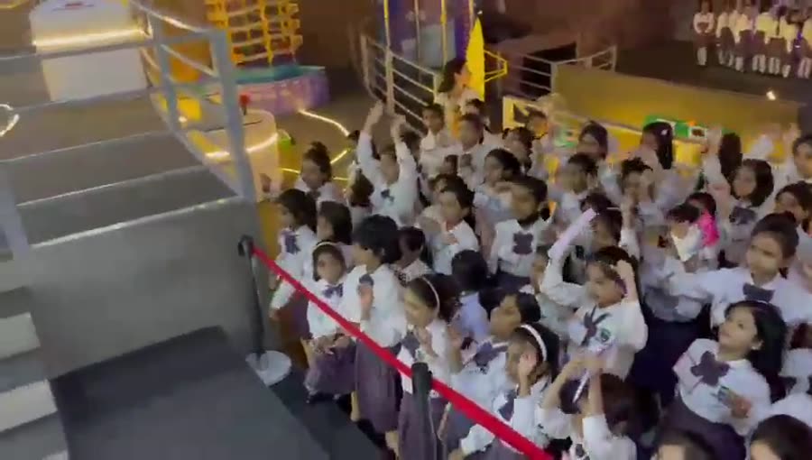 Students exploring Joy of Science exhibits
