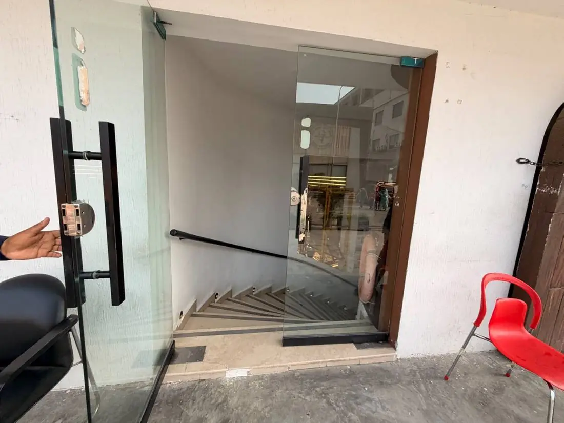 The open doorway of Joy of Science Lahore revealing the staircase to the museum floor