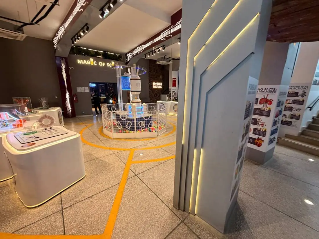 Interactive exhibit stations in the Central Foyer at Joy of Science Lahore