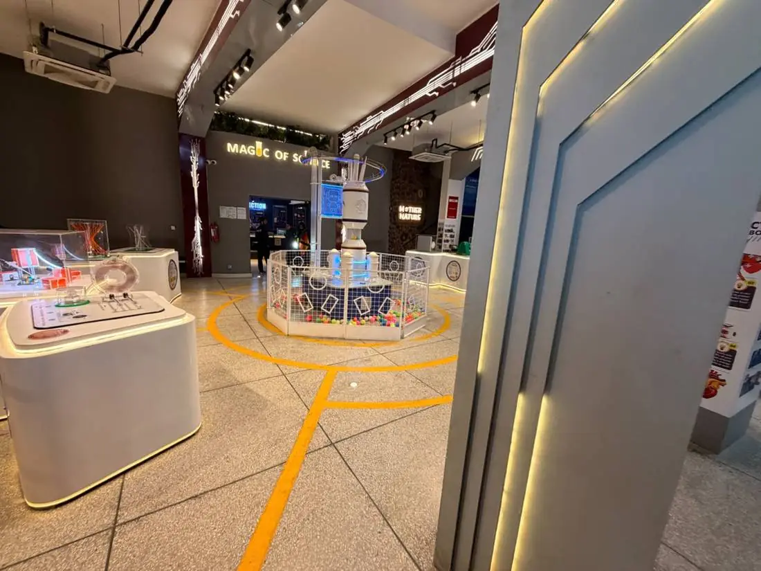The exhibit floor and central ball-circulation exhibit at Joy of Science Lahore